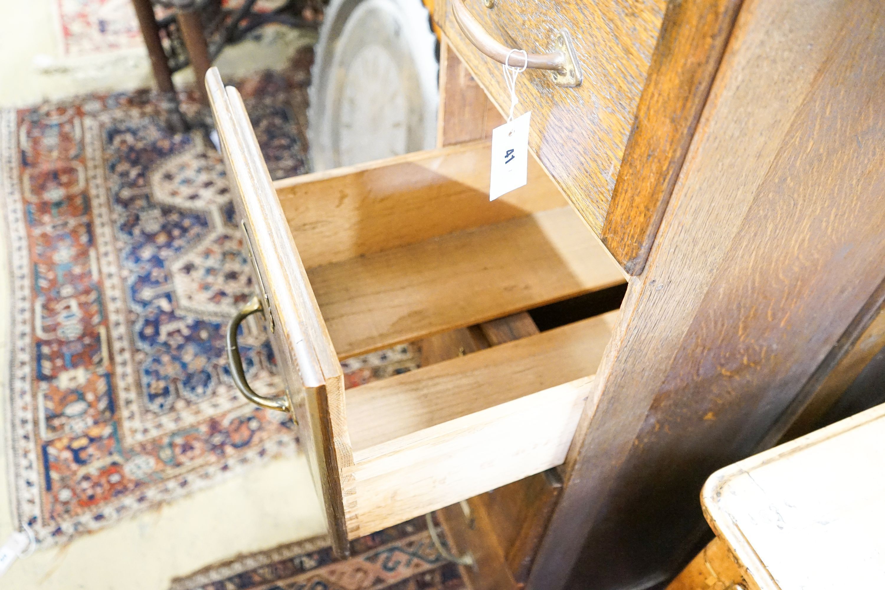 An early 20th century oak four drawer filing cabinet, width 37cm, depth 70cm, height 130cm